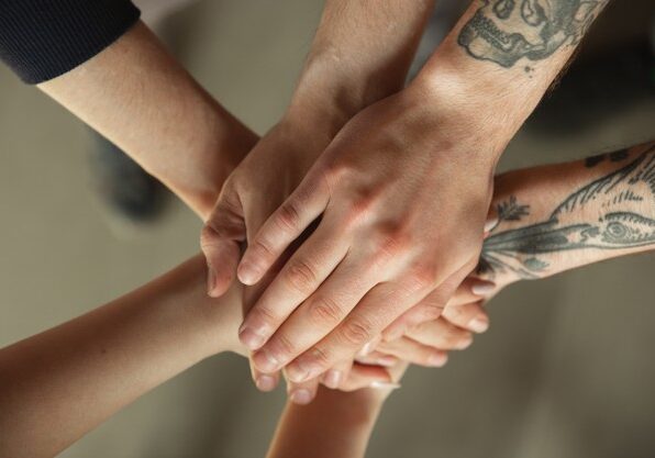 close-up-male-female-hands-covering-one-another_155003-32007