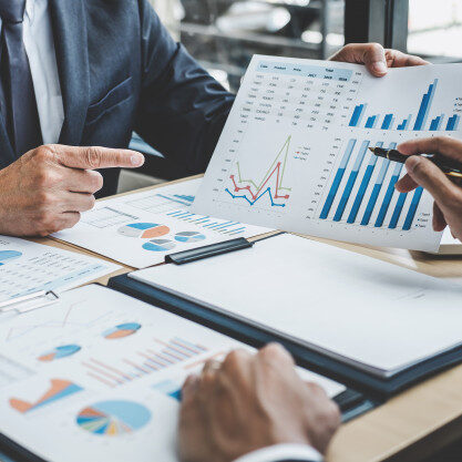 two-executive-discussing-company-growth-project-success-financial-statistics_28283-1078